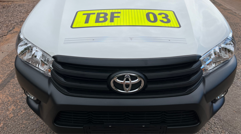 Toyota Hilux with reflective mine identification stickers on it to comply with mining regulations